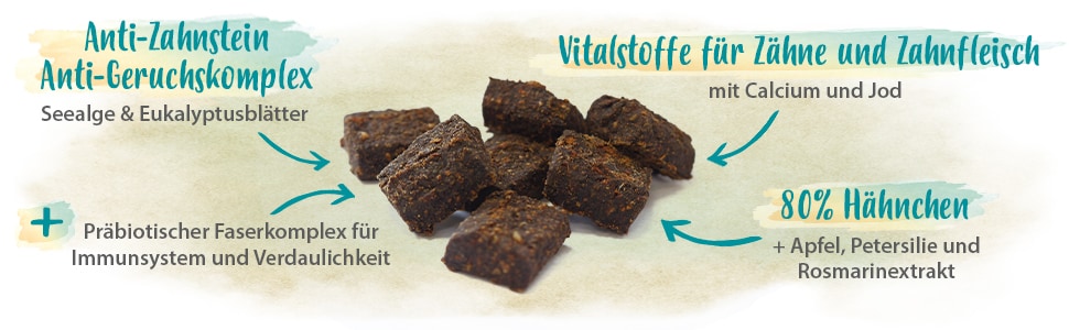 Strahlemann Eigenschaften Ein paar Stückchen Strahlemann mit den Schriftzügen 'Anti-Zahnstein Anti-Geruchskomplex' '80% Hähnchen' 'Vitalstoffe für Zähne und Zahnfleisch'